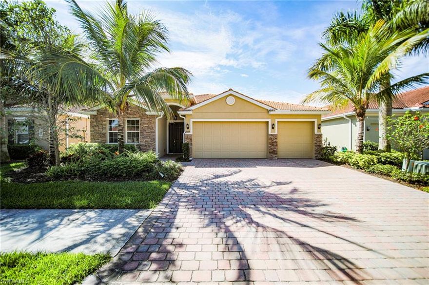 Spacious open concept 4/3 with the 3rd garage right on the lake!