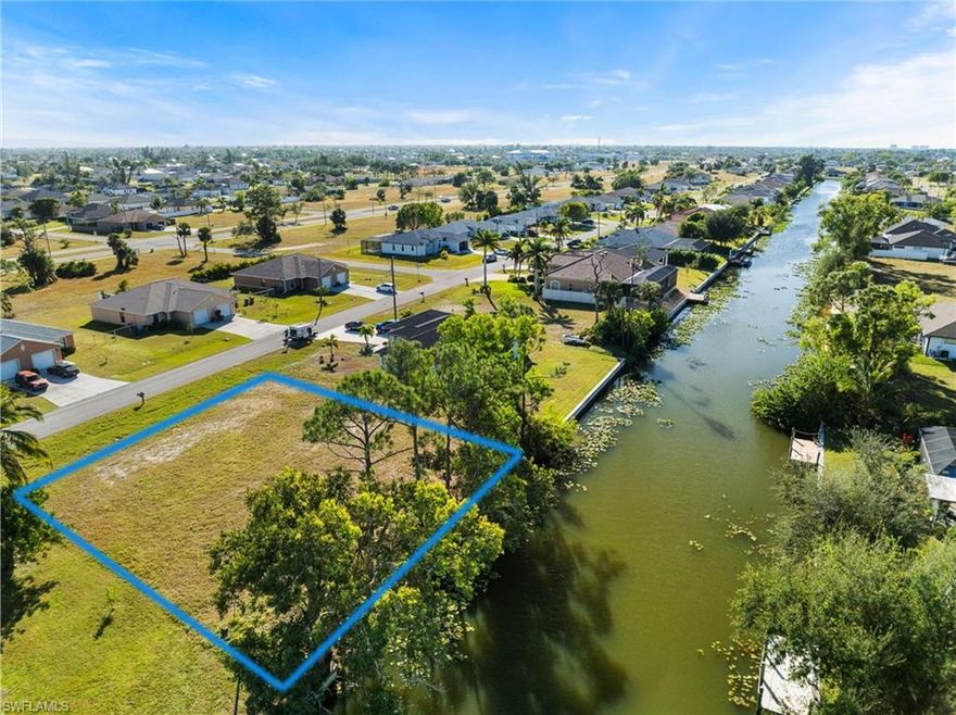 This TRIPLE LOT in Cape Coral is a BEST VALUE BUY with only $7,000 left on the utility expansion bill!  The property is NOT IN A FLOOD ZONE, mostly CLEARED, and ready for you to build your perfect oasis with endless possibilities for customization and enjoyment.  With NAVIGABLE FRESH WATER CANAL access, you can easily explore the Cape waterways right from your backyard.  The WESTERN EXPOSURE allows you to enjoy glorious SUNSETS every single evening. Located just minutes away from Strausser Sports Complex, Sun Splash Water Park, Lake Kennedy Community Park, and Palmetto Pine Country Club, you'll never run out of things to do in this vibrant community.  And with shopping, dining, and entertainment options just a stone's throw away, you'll have everything you need right at your fingertips.  Whether you're looking to build your dream home or next rental property, this perfect lot has it all.  Don't wait any longer to make your SWFL dream a reality!