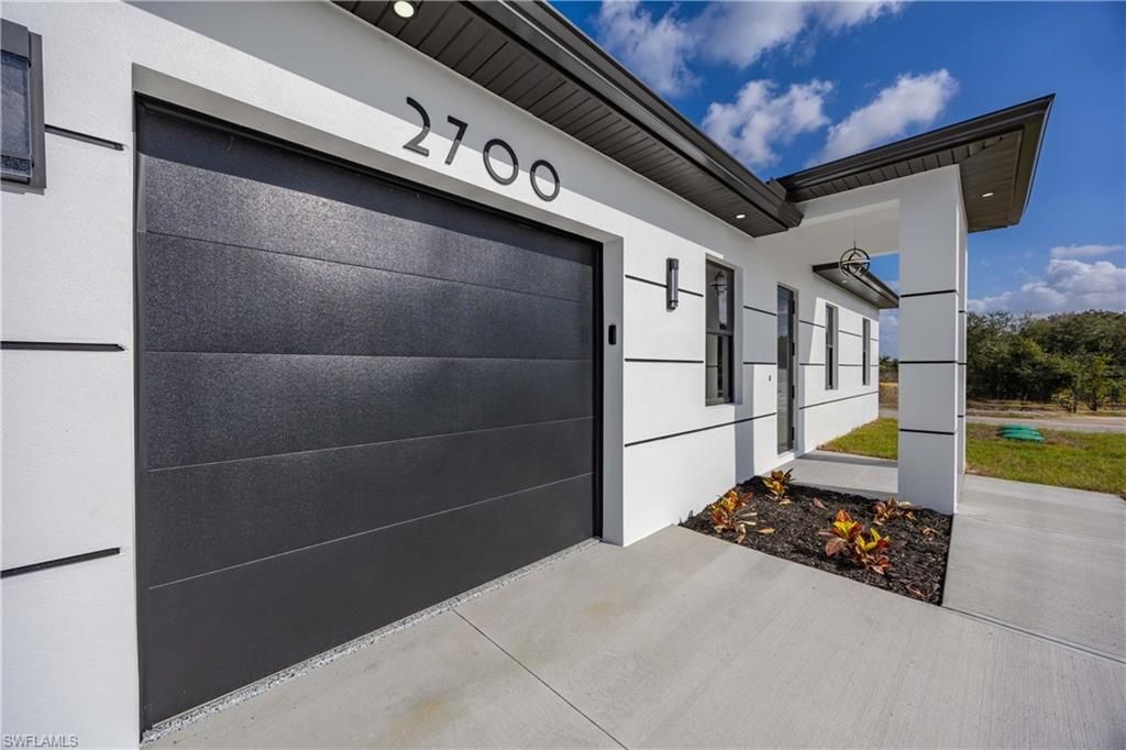 Photo of 2700 49th ST SW, LEHIGH ACRES, FL 33976 (MLS # 226012297)