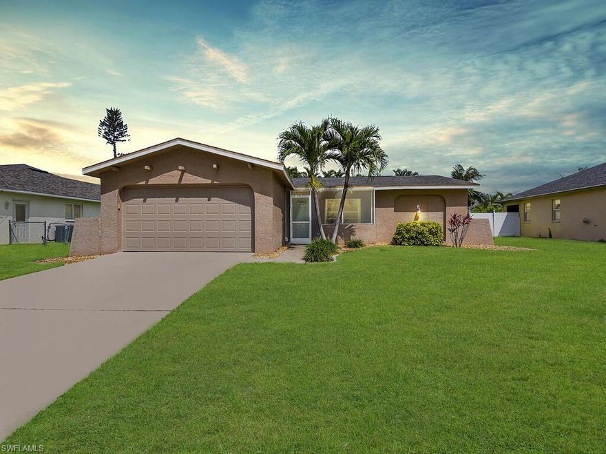 Beautiful updated 4 bedroom 2 bathroom home with a new roof and newer A/C, located in the highly desirable Southeast Cape Coral close to great shopping and dining! You will be wowed with this newly updated kitchen; featuring, huge center island, tons of counter space and cabinet storage, and bright lighting. Guest bathroom features an updated shower tub combo and dual sinks.  Enjoy your own private pool in a screened in patio, fenced in yard, privacy hedge and firepit! This is the perfect home for entertaining!