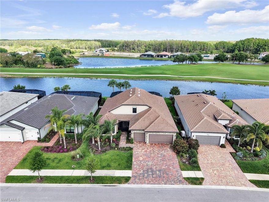 Welcome to Del Webb 55+ at Ave Maria! This LIKE NEW 2023 lakefront / golf course pool home offers sweeping long lake & golf course views will take your breath away! This home has been updated with the finest in fixtures and builder options including a gourmet kitchen with 42 inch cabinetry, quartz countertops and adorn with Kitchen Aid appliances including a double oven for the chef in the house.  The extended island seats 4 comfortably and the dining rooms is surrounded by windows, the lake and greenery of the golf course. The first floor has  been thoughtfully designed with neutral paint throughout, Level 5 12 x 24 porcelain tile, high end carpet with 8lb padding in all bedrooms all designed to be beautiful as well as functional. The 1st floor boasts 3 bedrooms, an oversized den & 3 adjacent bathrooms plus an additional pool / guest bathroom. The primary bedroom, located on the 1st floor sits in the rear of the home overlooking the water & golf course & boasts oversized windows with custom draperies. The  primary bath has a super shower with extended tile, light neutral 12 x 24 tile and an abundance of cabinets and quartz countertops. The upstairs is perfect for extended family visits with an additional bed and bathroom and oversized loft perfect for socializing. The exterior of the home is equally exceptional with its three car garage, impact doors & windows and storm smart shutters in the rear of the home for added peace of mind.  The home opens directly from the family room out into the extended lanai and oversized custom pool complete with picture window screening, sun shelf, spa and outdoor kitchen for endless entertaining opportunities while enjoying the spectacular water & golf course views. 
Ave Maria, a nationally recognized BLUE ZONE® and top Master Planned ranked nationally entitles residents to enjoy beautiful downtown Ave maria with its glorious town center, many dining options, weekly events, parks, trails and Ave Maria University. The vast amenities include the wonderous resort Pool including Lap Pool / jacuzzi, Fitness Center, 12 Pickle Ball courts /Tennis courts, Bocce, Golf Simulator, movement room and the optional opportunity to join the golf club.