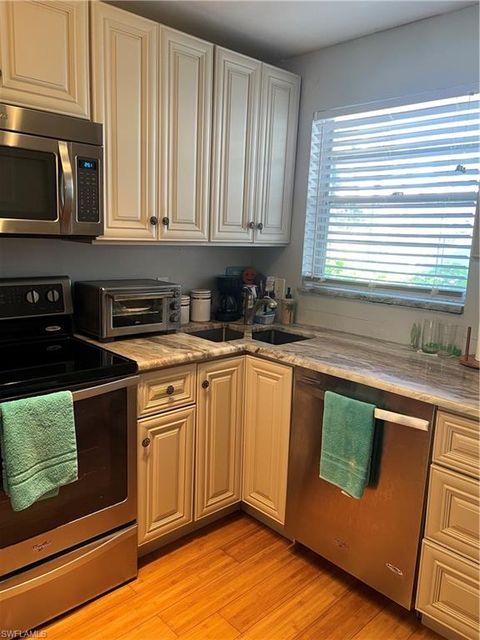 Photo of 501 Forest Lakes BLVD #107, NAPLES, FL 34105 (MLS # 226023704)