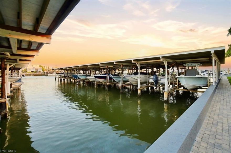 NO STORM DAMAGE to the unit.  Discover the epitome of SWFL DOWNTOWN NAPLES Paradise Life AND Boat Living!!! Sought after —- RARE DEEDED & COVERED BOAT SLIP is INCLUDED with residence and just minutes to epic experiences at Keewaydin Island w/no bridges !! T-H-I-S is your FULLY REIMAGINED, LUXURY DOWNTOWN dream come true CONDO! Location… location … LOCATION ::: WALKING DISTANCE to charming TIN CITY, luxurious 5th Ave shopping & dining experiences, trendy 3rd St S. eatery & boutique memories AND just steps from nightly SUNSETS at our award winning sugar white sand beaches! MAINTENANCE FREE::: LUXURY, high end FULL renovations were completed on every square inch. Enjoy the convenience of quick GULF deep water ACCESS, from this completely - down to the studs - HIGH END renovated condo! This 2nd floor residence has had NO HURRICANE DAMAGE from any of the last 3 storms! And affords 2 bedrooms plus a BONUS: a SUNNY +DEN! Enjoy the privacy of a secluded primary en-suite wing, while the adjacent guest wing also offers an en-suite private bath. This luxury unit has been fully re-finished w/meticulous attention to every detail. The modern, coastal selections and styling, including a new open kitchen/living /den floor plan is enhanced w/ wide-plank ash wood-look tile flooring & ideal white plantation shutters. The designer lighting package , crisp and desirable modern white quartz surfaces throughout have been complimented w/warm timeless hardware finishes in a mixture of matte black, champagne gold & satin nickel to have a custom feel. The FULL BATH large format designer TILE work further display the beautiful high end finish quality of the detailed condo renovation. The boat dock & water access, and proximity to Naples' dining and shopping on 5th & 3rd make this unit an IDEAL RENTAL or 2nd home SNOWBIRD investment. Don't miss this opportunity to capture your very own piece of OLDE NAPLES paradise in this hidden DOWNTOWN NAPLES gem WATERFRONT COMPLEX.***