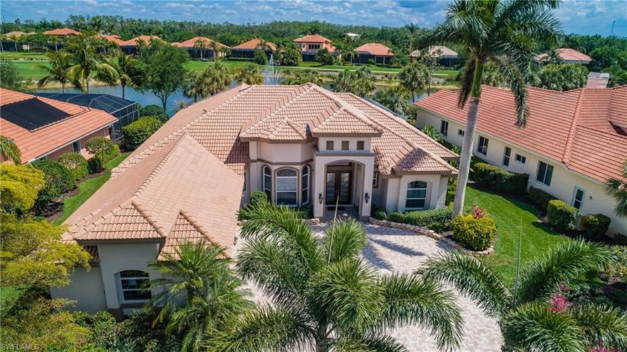 Exceptional custom beauty in Grande Estates w/beautiful lake & fountain view!Trayed ceilings w/undermount lighting & crown moulding throughout; 4 bedrooms,3 ½ baths,office w/custom built-in cabinets. Large owner’s suite has 2 walk-in closets, bathroom w/2 separate vanities, whirlpool jacuzzi tub, & tiled walk-in shower! Enter thru the gorgeous front double wood doors into the living room & formal dining room, all w/custom woodwork,custom window treatments, & custom paint.  Kitchen has beautiful granite counters & island, upgraded cabinets, double oven w/separate cooktop, tiled backsplash, counter w/barstools, breakfast area, & a unique walk-thru serving area between the formal dining room & kitchen.Kitchen overlooks the greatroom w/built-in cabinets, & opens to the newly screened lanai w/ picture window screens, granite outdoor kitchen area, refrigerator, outdoor tv,custom pool/spa. Surround sound, security system, new hurricane impact windows, electric hurricane shutters, 3 car garage w/air conditioned storage room.Entire new tile roof replaced in 2017, front of the home has a completely new redesigned façade. A must-see home!