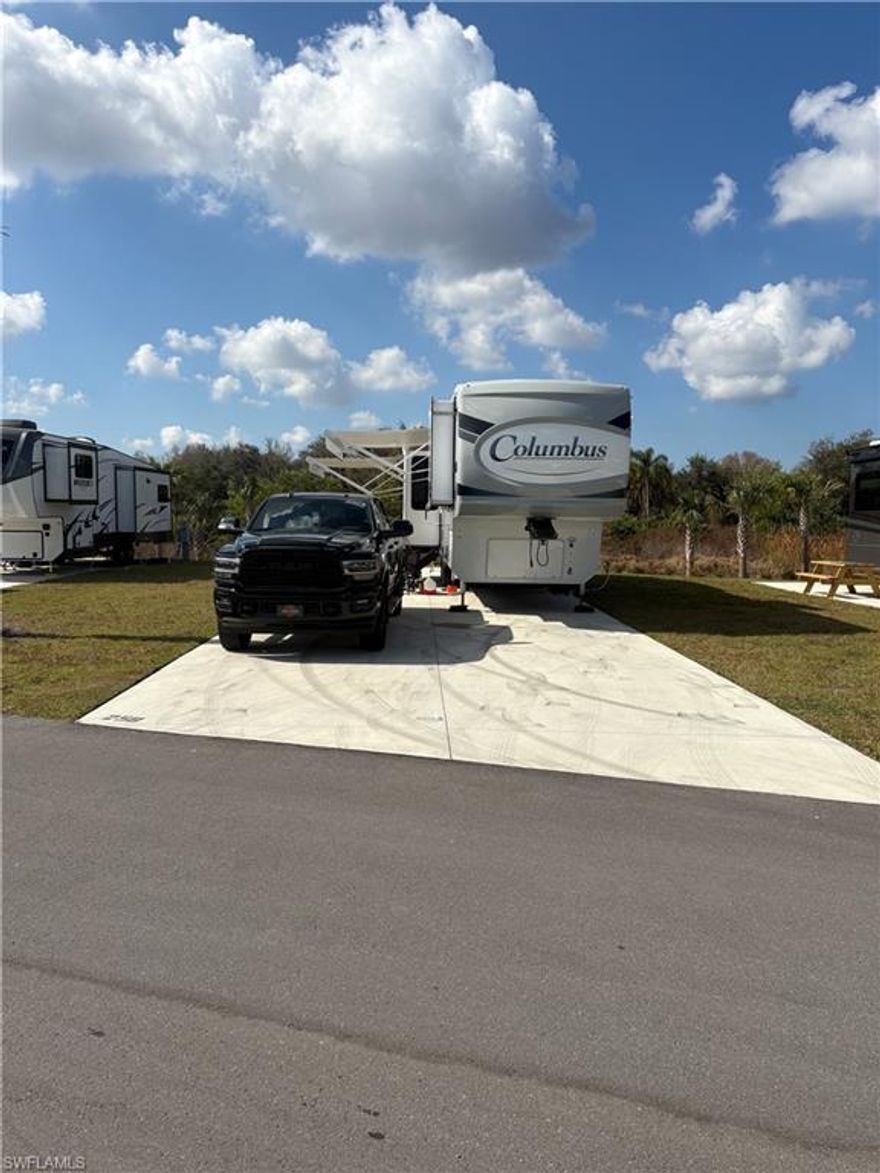 Lot 258 is a desirable perimeter RV site offering enhanced privacy and peaceful surroundings within Palm Breeze RV Resort. Positioned along the outer edge of the community, this site enjoys generous green space on multiple sides, creating a more open and private setting compared to interior locations.

Situated toward the back of the resort, this RV site benefits from minimal traffic and a quieter atmosphere—ideal for those seeking a relaxed Florida retreat. Located directly across from waterfront sites, it offers proximity to scenic water views without the premium waterfront pricing.

This site comes complete with electric pedestal and water spigot already in place, allowing you to simply pull in, hook up, and immediately begin enjoying all that the beautiful Southwest Florida lifestyle has to offer in charming Punta Gorda.

An exceptional opportunity to secure a private, ready-to-enjoy RV site within one of the area’s premier luxury RV resort communities.