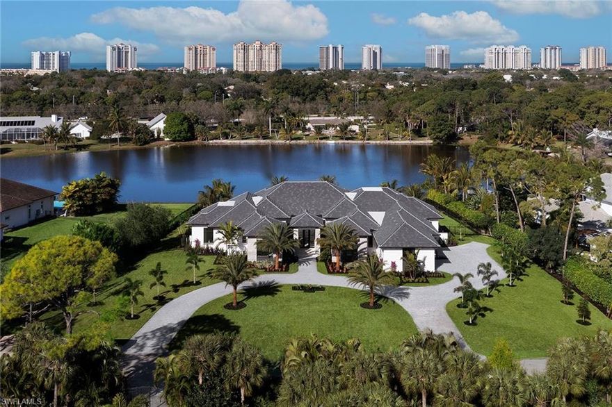 Welcome to this luxurious lakeside new construction custom home in the exclusive Pine Ridge Estates neighborhood. This nearly 5,500 square foot 4 bed plus study and club room, 4 full and 3 half bath custom estate designed by Stofft Cooney Architects and hand crafted by Stock Custom Homes resides on an incredible west facing 1.14 acre long lake view homesite.  The open floorplan with nearly every room overlooking the picturesque lake views is perfect for entertaining family and friends including a gourmet kitchen complete with an oversized island with quartz waterfall sides, Wolf/Sub-Zero appliance package that opens to a large great room with soaring ceilings and exposed beams.  The outdoor living is a spacious, tranquil retreat with ample covered area, infinity edge pool with spa and dual fire bowls, outdoor kitchen and bar plus a separate sitting area with gas fireplace and all enclosed with automated screens and hurricane shutters.  Additional features include a 4-car attached garage, Andersen impact-resistant windows and doors, glass climate-controlled wine room and Control 4 home automation.  A world of luxury awaits you in the centrally located Pine Ridge Estates.