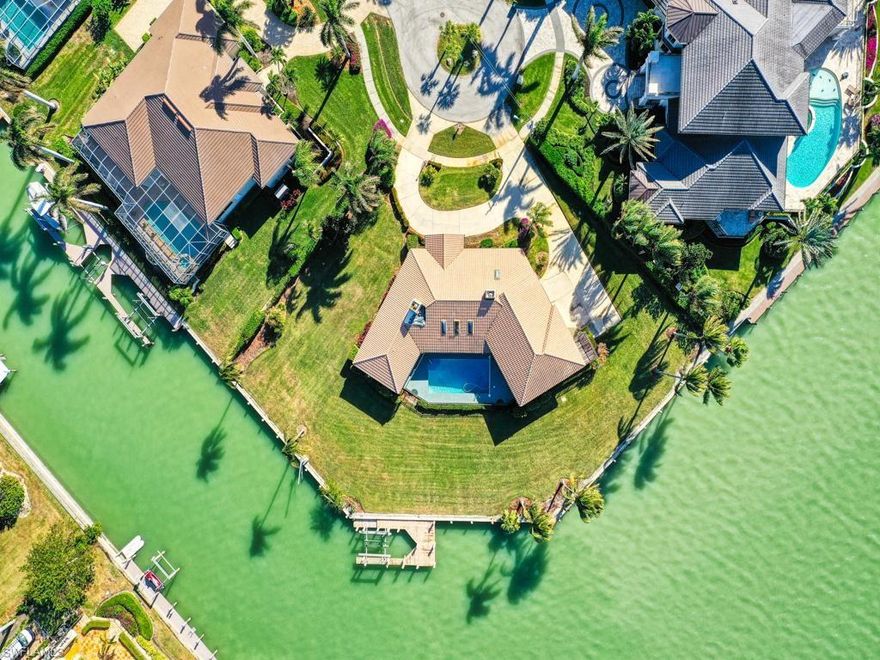 Discover the pinnacle of luxury waterfront living on this rare trophy lot in Marco Island’s prestigious Estates!  

This extraordinary .59-acre tip lot, located at the end of a quiet cul-de-sac, offers an unparalleled opportunity to create your dream estate. With an impressive 300 feet of deep water frontage wrapping around three sides of the property, this homesite provides unobstructed panoramic views of pristine waters, ensuring privacy, tranquility, and breathtaking vistas from every angle.  

Designed for the ultimate boating lifestyle, the property features three sides of water frontage, each approximately 100 feet wide, allowing versatile docking options. Whether you have a long yacht or multiple watercraft, you can dock along one side, preserving the sweeping water views that will define your future home.  

Ideally situated just 5 minutes by boat to the Gulf of Mexico, this deep-water direct-access property accommodates larger vessels with ease. It’s a true haven for boating enthusiasts and those seeking the quintessential Florida lifestyle.

Spend your days fishing in world-renowned waters, taking in stunning sunsets, and enjoying easy access to Marco Island’s finest dining, shopping, and entertainment—all just minutes away.  

Whether you envision a sleek, modern retreat or a timeless coastal masterpiece, this exceptional lot offers endless possibilities to design a residence that seamlessly blends with its natural surroundings.  

Don’t miss this once-in-a-lifetime opportunity to own one of Marco Island’s most coveted waterfront properties. Lots of this caliber are a true rarity—secure your piece of paradise today!