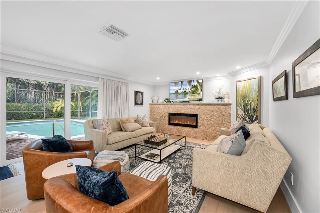 Photo of 635 Fountainhead LN, NAPLES, FL 34103 (MLS # 225078307)