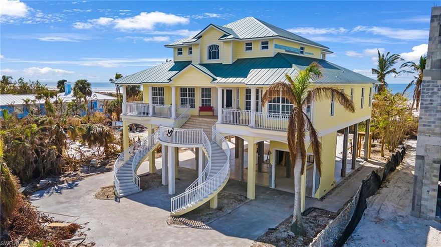 MAJESTIC Beach front ELEVATED CONCRETE home featuring 3500 sq ft of Elevated under AC living areas. This is a Direct on the Sand Gulf front parcel with 75' width and 200'+/- depth of the most sought after location on the south end of Ft Myers Beach. Open Concept living allows you to relax and watch Gorgeous Sunsets in this spacious home featuring high ceilings,  Bamboo and Ceramic Tile floors, an oversized deck and lanai areas that overlook the absolute best sands on the island. Refreshed bathrooms and kitchen in 2015. METAL roof Rescrewed in 2018. Additional Features include: Large heated pool w/ large deck area, Elevator, Oversized garage areas, Fireplace. This is your chance to MOVE IN shortly to an Amazing Gulf Front home. Save yourself years of waiting, Here is YOUR opportunity to move into Your DREAM Beachfront home. HOME AFFECTED BY IAN. See the Pre Storm and some Post storm photos. Walking distance to the Santini Plaza and bicycle or walk the beaches to the Pier district. Hurry, Come and see this Magnificent home. INTERIOR PHOTOS COMING SOON.