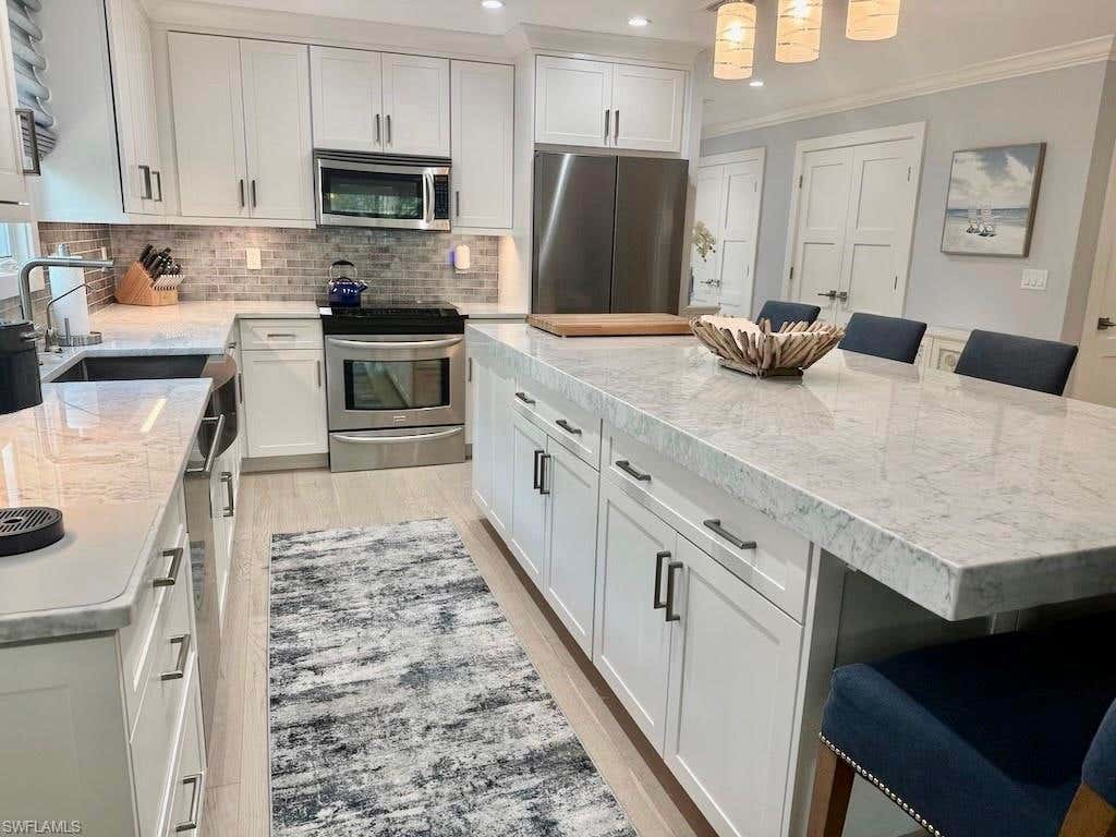 Photo of 225 5th AVE S #103, NAPLES, FL 34102 (MLS # 226021821)