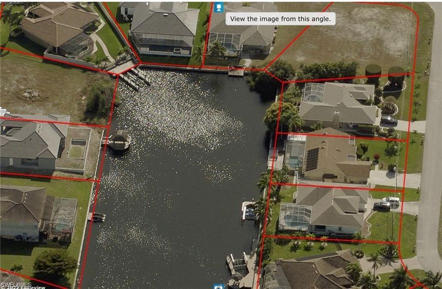 This is one of the few remaining oversized Corner Lots with Gulf Access in the South West of Cape Coral. Nestled in a quiet neighborhood with nice Pool Homes and perfect manicured lawns with no drive through traffic. All Assessments paid. The Gulf Access corner triple lot provides the opportunity to the prospective Owner to build a spacious Custom Pool Home with a 3 or 4 Car Side Loader Garage and four or five Bedrooms and Baths depending on which Style you choose for your new Florida Residence. Enjoy the Views down an extra wide, large salt water canal or use your own boat to explore the Florida Lifestyle at its best. Rare chance to fulfill your own ideas for a Florida Dream Home on an oversized Corner Lot still reasonable priced.