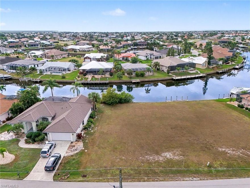 Build your dream waterfront home within the enviable Punta Gorda Isles (PGI) community. This vacant lot on Pine Siskin Drive offers quick and direct canal access leading to Charlotte Harbor and the Gulf of Mexico. Enjoy boating, fishing, and the Florida lifestyle right from your backyard. The property provides ample space for a custom single-family home with room for a pool, dock, and boat lift. Located on a quiet street yet close to shopping, dining, and area amenities, this lot combines tranquility with convenience in one of Southwest Florida’s most desirable boating neighborhoods.