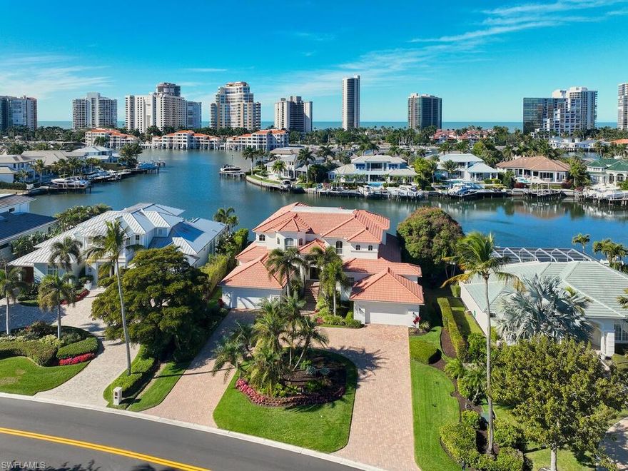 Panoramic water views define this luxury Park Shore home, just a short walk from the white sandy beaches. This stunning two-story waterfront residence offers true elegance with spectacular bay views. The home features 6 bedrooms and 6 baths, with the primary suite, one guest bedroom, pool bath/powder room, family room, living room, study and one of the two laundry rooms conveniently located on the main level. Upstairs, you’ll find 4 additional guest bedrooms, 3 baths, a second laundry room and a loft lead to an oversized terrace, an ideal setting for sunset views or quiet relaxation. This spacious residence seamlessly blends comfort and convenience in one exceptional location. Property Highlights: Expansive living room, family room, and upstairs loft, Elegant dining area and cozy breakfast nook, Gourmet kitchen fully equipped, Private heated pool, spa, boat dock and sundeck overlooking the bay, 3 car garage. Hurricane-impact windows and sliding glass doors throughout. Tile floor on the 1st floor living areas, wood floors in the primary bedroom and 1st floor guest room and the entire second floor areas. Exclusive private beach access to Park Shore Beach, including parking, sunset picnic area, restrooms, and showers. Short walk to Venetian Village and Waterside Shops; minutes from downtown Old Naples. Whether you’re relaxing by the pool, watching a sunset over the bay, or exploring Naples finest dining and shopping, this waterfront retreat offers everything you need.