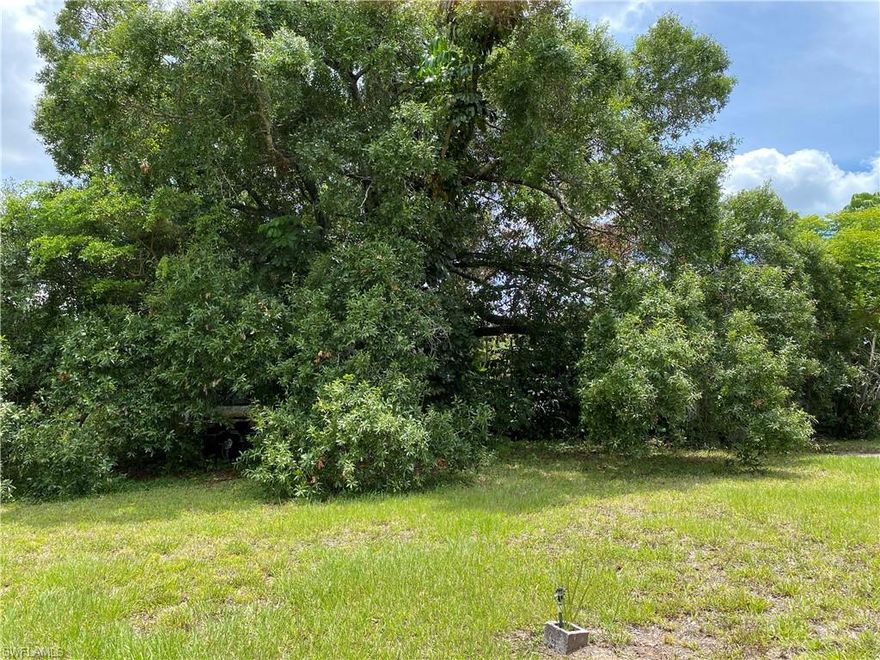 Hard to find, double lot in beautiful Bonita Springs - Oak Creek Manor.  .56 acres  Flat lot with fruit tress and curved, paved driveway. Lots have city water and sewer, electric and cable going to property.  Zoned for trailers, mobile homes, manufactured homes and single family homes.