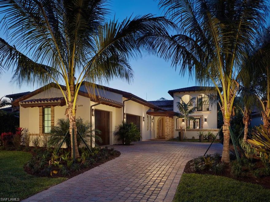 MODEL HOME by London Bay Homes with the four bedrooms/4 baths. Fully furnished by Romanza Interior Design, the Capriano’s 4,493-square-foot open floor plan features a great room, adjoining wine bar and library with pocket sliding glass doors that open to an outdoor living and kitchen area. A trio of arches frame views of a large custom pool with cascading waterfall fountain and spa, and nature preserve.  In the evenings, a fire pit offers the perfect gathering spot. An open staircase with decorative railing ends at a wet bar positioned to serve a second-floor lounge and guest suite with balcony, while a sun deck offers a bird’s eye view of the pool and preserve.