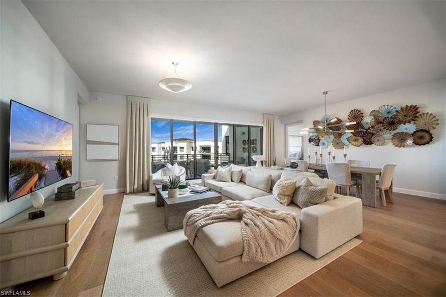 H14203 Indulge in the pinnacle of modern living with this band new pristine top-floor residence. Included is a private 2-car enclosed garage w/extra storage. Fully decorated w/furniture, art, drapes, & motorized blinds. Revel in serene surroundings & captivating views while enjoying the abundance of amenities. Open floor plan boasts clean lines & modern design, featuring a spacious kitchen w/a large island, Thermador appliances which include a gas cooktop. Hardwood floors, upgraded lighting, walk-in pantry, all en-suite bathrooms, Sony TV’s, outdoor gas grill & summer kitchen. The primary suite is a haven of relaxation w/a large walk-in shower, soaking tub & dual vanities. Residents can enjoy numerous amenities, including a lap pool, cabana bar, gas grills, hammocks, Bocce ball, putting green, yoga lawn, dog park, fitness center, game room, theater, private shuttle & guest suites. Convenient features like secure garage parking, bike racks & additional storage add to the ease of everyday living. Ideally located within walking distance to 5th Ave. S. shopping, dining & entertainment, as well as Naples’ white sandy beaches, this is the epitome of Naples living at Eleven Eleven Central.