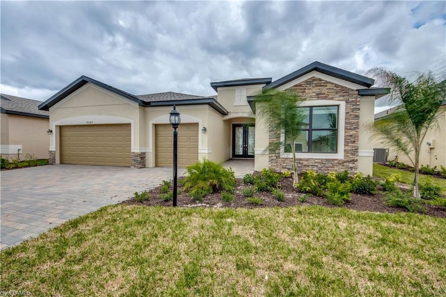 Just completed and never lived Manor Series home from Lennar called the Summerville in Portico ready for you. This gated community which is nestled off Buckingham rd and minutes to Publix and short drive to downtown Fort Myers and waterfront dining. This waterfront home has a 3 car garage, 3 bedroom 3 bath home with 2,445 sqft of living space and many upgrades that were done by the builder. Most of them will grab your attention as soon as you step through your double front entry doors into the foyer. The crown molding stretches all throughout the main living area, owners suites, and trays in the ceilings. The floor was also upgraded with beautiful plank tiles covering all that goes perfect with the huge granite island in the kitchen that matches the bathrooms and white cabinetry. Summerville has an open concept with plenty of space for the avid cook or those who love entertaining. With this gorgeous kitchen also comes a formal dining and walk in pantry. If that hasn't convinced you this is the home yet the owner's suite will. It is located on the back side of the home with its own private entry to your screened in lanai, huge walk-in closet, walk in shower and dual sinks.