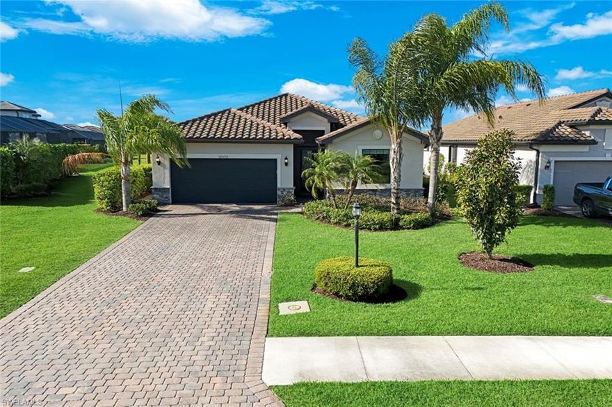 Resort Style living at The Place at Corkscrew is the place to be! This beautifully upgraded 4-bedroom, 3-bath residence offers the perfect blend of luxury, comfort, and Florida lifestyle living.

Step inside to an open-concept floor plan designed for both everyday living and entertaining, featuring a spacious living area enhanced by a custom-built fireplace and elegant built-in shelving. The home is thoughtfully upgraded throughout, including custom closets for optimal organization and professionally sealed flooring for a polished, move-in-ready finish.

The kitchen and main living spaces flow seamlessly to the outdoor retreat, where you’ll find your own private oasis. Enjoy the extended lanai complete with a custom kidney-shaped pool and spa, perfect for relaxing or hosting guests. A picture window screen enclosure frames the stunning lake view, creating a serene and unobstructed backdrop. The outdoor space is elevated even further with a custom mini bar featuring cabinetry and a mini refrigerator—ideal for entertaining Florida-style.

Additional highlights include a mini-split air conditioning system in the garage, adding comfort and versatility to the space, as well as upgraded cabinetry in the laundry room for added functionality.

Located in the highly sought-after community of The Place at Corkscrew, residents enjoy world-class amenities and a vibrant lifestyle in the heart of Estero.

This is more than a home—it’s a lifestyle. Schedule your private showing today!