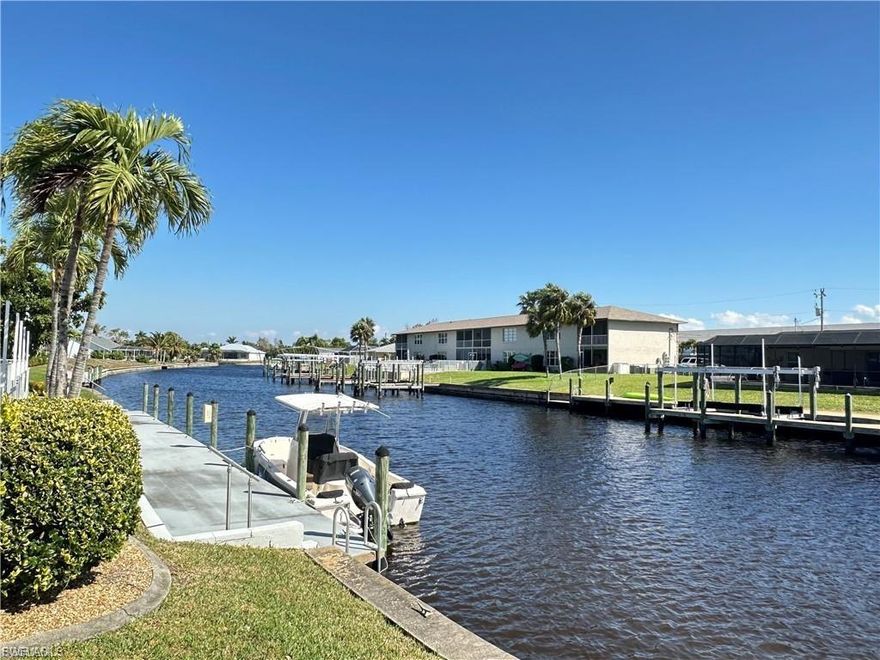 **Wonderful Gulf Access Condo**Ready to move in to** Located in the Heart of SE Cape Coral ** Easy access to everything ** Spacious Open Floor Plan ** Impeccably Clean and fresh **Tile and Wood Floors ** Inside Laundry with extra storage ** 2 Bedroom 2 Bath ** Spacious Lanai **Stainless Appliances **Roof new in 2024**Hot Water Heater 2025 **Brand New Hurricane Shutters the length of the lanai in 2023 ** New screens in lanai**Window in Guest bed is Hurricane window **  Plenty of Dock Space available for your Boat** Quick access to Gulf ** Sparkling Heated Pool ** Large Community room with full kitchen for your Parties ** Unique Work room with tools and gadgets for the handyman ** Wonderful 55+ Community **Financially sound HOA **  Don't miss this ** Won't last at the price **