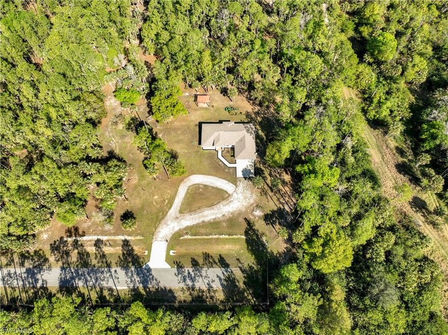 INCREDIBLE VALUE for your private Naples retreat, set on 4+ acres of land at the end of dead-end street, offering exceptional space, privacy, and freedom—with no HOA fees or restrictions. Built in 2019, this newer construction home (ADA accessible) combines modern open floorplan design with the rare opportunity to enjoy acreage living just minutes from Naples's conveniences. Surrounded by natural beauty, this property provides a peaceful, secluded setting ideal for those seeking privacy, outdoor space, and flexibility. With ample room for a pool, guest house, workshop, recreational vehicles, boats, animals, or future expansion, or split the lot into 2 lots (95% uplands) the possibilities are endless. Inside, the home features a contemporary open layout designed for comfortable living and entertaining, with modern finishes and systems that provide efficiency and peace of mind. Whether you’re looking for a primary residence, a private relocation property, or a long-term investment with land value, this home delivers versatility and lasting appeal. Enjoy the freedom to live your lifestyle your way. Bring your toys, animals, or vision without HOA rules or limitations. Peace of mind with generator hook up to the electric panel. All of this while still being within easy reach of shopping, dining, beaches, and everything Naples has to offer. A rare combination of newer construction, acreage, privacy, and no HOA—this is Florida living with room to grow.