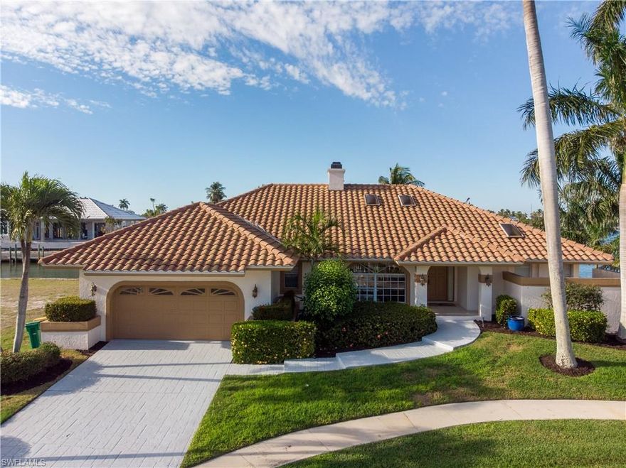 Great cul-de-sac home and location! 148'ft of direct boating access to River and Gulf. Fantastic intersecting canal, bay and partial Bridge views. Expansive dock and lift/seperate davit.Pavered lower patio. HOuse features volume ceiling with sky-lights. Sliders open to expansive elevated lanai. large pool and hot tub, newer pool heater. Two car garage. Home is a possible remodel or can be removed for ideal lot for larger home.