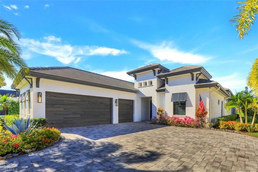 THE ONLY SINGLE-FAMILY HOME AVAILABLE IN CORSICA! Stunning estate with lake & golf course views through floor-to-ceiling retractable glass doors in highly sought-after Corsica at Talis Park. This home is brimming with custom designer touches & stylish décor that is fresh & inviting with hues of aqua & beige accents throughout. Two separate living areas (inside & out) are yours to enjoy, along with a gourmet kitchen & enormous island, stunning quartzite counters, top-of-the-line appliances, a walk-in pantry, adjacent wet bar with wine cooler & 2 separate dining areas (inside & out). An exceptional outdoor oasis boasts seamless indoor-outdoor entertaining with a glistening pool/spa, ample seating & a summer kitchen with built-in gas grill. Master bedroom suite offers private access to massive lanai through sliders & 2 walk-in closets. Master bath boasts dual vanities with quartzite counters & a huge walk-in rainfall shower. Upgrades include A/C in garage, clear view screen enclosure, custom surround sound & more. Amenities include golf, tennis, fitness center & more. A short drive to world-class beaches & fine dining & shopping, LUXURY awaits you here!