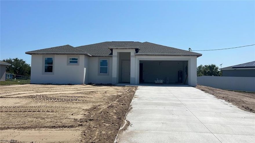 Under construction: Beautiful and SPACIOUS 3 BEDROOMS 2 BATHROOMS. This home was designed modernly with a lot of features: Tray ceilings, lanai under truss, impact resistant windows and doors, all tile floors, floor to ceiling tiled master shower, 8’ interior doors, 9'4" ceiling high, Stainless steel appliances, Automatic garage door opener, ceiling fans in bedrooms great room and lanai, a nice size laundry room with a sink near the garage. BUYER INCENTIVE: AT CLOSING, THE BUYERS WILL RECEIVE A 10 YEAR WARRANTY POLICY FOR THE NEW HOME FROM THE SELLER! + ADDITIONAL $5,000.00 SELLER CREDIT TOWARD CLOSING COSTS WHEN BUYING A HOME USING OUR AFFILIATED LENDER, MIAMI MORTGAGE ADVISORS. 3D walk through link: https://mls.kuu.la/share/collection/7qyVq?   ESTIMATED COMPLETION DATE MARCH 2023