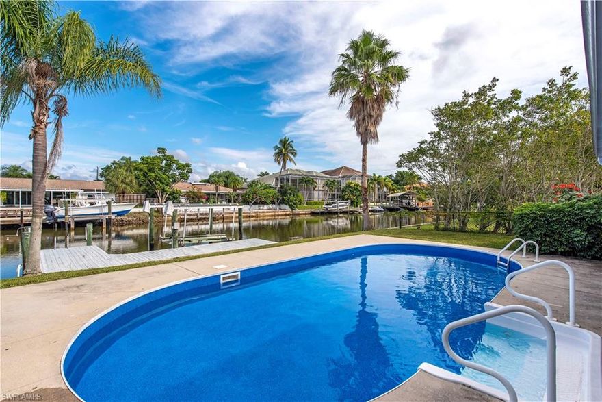 H1532 - Incredible opportunity to own a waterfront pool home in Vanderbilt Beach! Don't let the sq ft fool you, this 4 bedrooms 2 bathroom home lives much larger with plenty of room for the whole family. White Shaker Style Kitchen cabinets with stainless steel appliances upgraded bathrooms and more. If you need more room purchase this home and work with Lagrasta Custom Homes to build a waterfront home of your dreams.