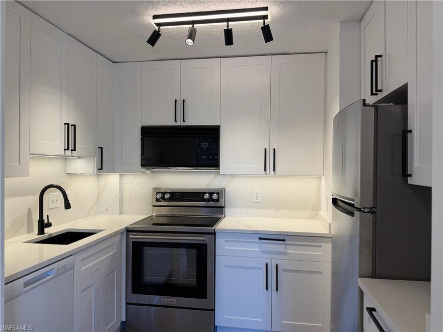 BEAUTYFULLY REMODELED 1-bedroom, 1-bath condo in the iconic First Harbour Towers, perfectly situated along the Caloosahatchee River in DOWNTOWN Fort Myers. This light-filled residence features IMPACT WINDOWS and an IMPACT SLIDING glass door, plantation shutters, a BRAND-NEW REFRIGERATOR, and a stylishly REMODELED KITCHEN and BATHROOM with elegant QUARTZ COUNTERTOPS. Step out onto the BALCONY, beautifully FINISHED with NEW TILE, and enjoy refreshing river breezes. The open-concept layout offers a seamless flow between the living, dining, and kitchen areas, creating a welcoming space ideal for both relaxing and entertaining. First Harbour Towers offers a prime riverfront lifestyle with a heated pool overlooking the neighboring marina and breathtaking sunset views across the river. The recently expanded pool deck features new pavers, a new fence, and convenient access to a large covered BBQ area—perfect for gatherings. The building has also been updated with new carpets and fresh interior paint (2024). One assigned covered parking space is included, along with ample guest parking.
Located on historic West First Street, you’re just steps from the Edison & Ford Estates, the Sydney Berne Davis Art Center, and the vibrant River District’s shops, dining, and cultural attractions. This is more than a condo—it’s a chance to live downtown, surrounded by history, river breezes, and a walkable lifestyle that makes Fort Myers so special. Enjoy an amazing value in one of the city’s most desirable riverfront communities.