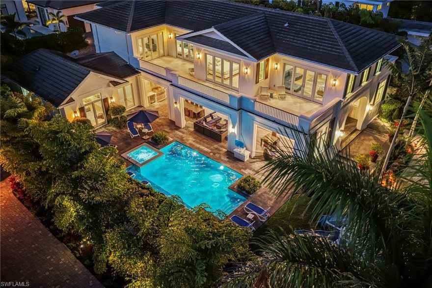 Available May-October $25,000/mo | Welcome to the ultimate fully furnished beach-side retreat in the heart of Old Naples, perfectly positioned just a 2-minute walk from the pristine white sands of the Gulf. This breathtaking coastal contemporary masterpiece encompasses over 6200 sq. ft. of luxury, featuring five beautifully appointed bedrooms, five luxurious ensuite bathrooms, a guest powder room, and a dedicated home office. The expansive open-concept floor plan showcases a gourmet chef’s kitchen equipped with top-tier appliances. Walk upstairs to the jaw-dropping projection room, perfect for game and movie nights, or step out to the large wrap-around balcony with a drink in hand overlooking the pool and enjoying the beautiful Naples sunset. Enjoy your own private tropical oasis where the pool and spa are perfectly positioned with southwestern exposure, complete with a play area for the children and grandchildren and a fully equipped summer kitchen protected by automated screens for outdoor meals in the twilight. Just a short stroll to the world-class dining and boutique shopping of 5th Avenue South, this home offers an unrivaled lifestyle of luxury and convenience. Make your next Naples vacation unforgettable.