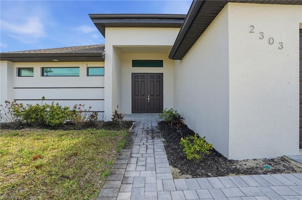 Photo of 2303 NW 18th PL, CAPE CORAL, FL 33993 (MLS # 226017955)