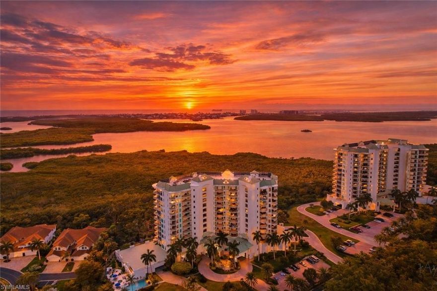 One or more photo(s) has been virtually staged, AI generated or rendered.  Imagine ending every day with breathtaking Western sunsets over Estero Bay from your own private corner residence in Bayview at Bonita Bay. Located on the fourth floor of this elegant 12-story waterfront tower, this beautifully maintained home offers the peaceful setting that makes Southwest Florida living feel like a vacation every day.

From the moment you enter the building, you’re welcomed by an inviting lobby before heading upstairs to a bright, spacious home designed to comfortably host family and friends. With three bedrooms plus a versatile study and three full bathrooms, the floor plan feels open and filled with natural light. Wide-plank wood flooring, lofty ceilings, and sliding glass doors frame views of shimmering water, lush greenery, and colorful evening skies.

The enclosed lanai adds additional living space, while three private balconies invite you to enjoy the coastal breeze.

The kitchen is ideal for everyday living and entertaining, featuring granite countertops, a center island, brand-new stainless-steel appliances, and abundant cabinetry.

The primary suite feels like a private retreat with large windows overlooking the scenery and a spacious bath featuring dual vanities, a soaking tub, and a separate walk-in shower. Each guest bedroom enjoys its own bathroom, and one includes a built-in Murphy bed ideal for a home office or additional sleeping space.

A standout feature is the private under-building two-car garage with extra storage. Residents of Bayview also enjoy a private gathering room with kitchen facilities, lounge seating, and dining space. Fresh interior paint provides a neutral palette ready for your personal style. The air-conditioning system was newly installed in 2026.

Residents enjoy more than 12 miles of scenic walking and biking trails, a private beach park with Gulf access via community shuttle service, a full-service marina with Backwater Jack’s restaurant and much more!  Optional membership opportunities at Bonita Bay Club offer golf, tennis, pickleball, fitness facilities, dining, and social activities.

Just outside the gates, The Promenade provides shopping, dining, and the popular Center Bar for cocktails and live music.

Homes offering panoramic sunset views, spacious living areas, private garage parking, a new AC system 2026, and the Bayview at Bonita Bay lifestyle rarely become available. 

Experience the views, space, and lifestyle firsthand, arrange your private showing today.