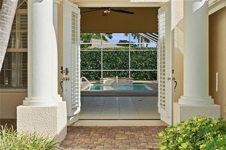 This meticulously cared-for four-bedroom, three-bath residence is located in the sought-after gated enclave of Briarwood. The open floor plan features an upgraded kitchen with granite surfaces, an induction cooktop, stainless-steel appliances and custom cabinetry. Plantation shutters are found throughout, and the owner has already begun upgrading the home with impact sliders and doors for added peace of mind. A spacious screened lanai showcases the solar- and electric-heated pool and spa with an extended paver deck, ideal for entertaining or enjoying Naples’ outdoor lifestyle. A small side-patio lake view subtly enhances the outdoor ambiance. With professional landscaping, lighting and an irrigation well, the property blends curb appeal with practical comfort. Residents enjoy 24-hour guard-gated security, low association fees, and access to tennis, pickleball, a clubhouse and resort-style pools—just minutes from downtown Naples and Gulf beaches.