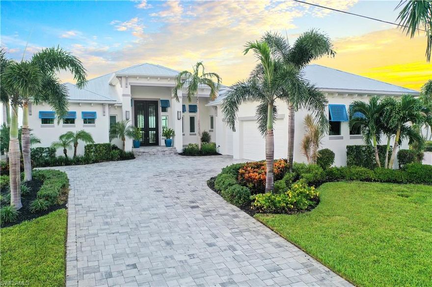Gulf Access waterfront oasis located highly sought after Savona neighborhood of Cape Coral Florida. As you enter this remarkable residence you will be captivated by the expansive eastern exposure waterfront views. In 2023 a lavish renovation transformed this already beautiful home into a true masterpiece. Luxury, comfort, and breathtaking views await you. Kitchen features sub zero refrigerator, Monogram Series GÊ appliances with gas cooktop, wine refrigerator, double island, and separate butler's pantry and additional second full size refrigerator/freezer. 500 gallon buried propane tank for the spa heater and cooktop. Entire house was repainted inside and out, updated fans, chandeliers, and lighting. Wide 8-3/4 premium engineered Oak wood floors, Tongue and groove Southern Pine wood ceiling inlays, stone, brick and ship lap accent walls, large 9-1/2" base boards, new pool equipment, Exterior decorative accent shutters, corbels, and outriggers, renovated outdoor kitchen with new BBQ appliances, flame table and Quartz countertops. New dock and lift features:33,000 LB super lift and 42'L x 14'W boat slip. Full list of upgrades available upon request. Built by Windward.