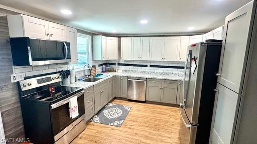 This beautifully remodeled manufactured home boasts 2 bedrooms, 2 bathrooms, and a bonus room that can easily be used as a 3rd bedroom or office space. Old Bridge Village is a Co-op and this home INCLUDES A SHARE. The open concept living area features water-proof laminate flooring throughout, stainless steel appliances in the kitchen, laundry inside and four mini splits to keep you cool on those hot summer days. Step outside to enjoy the community pool or relax in the Florida room that opens up for easy golf cart storage. Need extra space outdoors? This home has a large shed/workshop and a golf cart pad big enough for additional parking. Plus, with a new 40-gallon hot water heater, you'll never have to worry about running out of hot water. This home comes mostly furnished. Whether you're looking for a vacation home or a permanent residence, this home has everything you need and more. Don't miss out on the opportunity to own this slice of paradise in sunny Florida
Old Bridge Village, is a friendly, 55+ resident owned community right off the Caloosahatchee River and Gulf Access with lots of amenities, activities all year, clubs and entertainment.  There is a resort style brand new Salt-water  heated pool and hot tub, fitness center, recreation center, bocce ball, pickleball, shuffleboard, tennis, basketball, putting green, horseshoe pits, community clubhouse, fishing pier, kayak and boat launch and an 81 slip marina.   Drive your golf cart around the community, to and from your activities or to Palm Point where you can fish, have a picnic, watch the boats or just enjoy the sunset.  This community is a hidden gem with just minutes by boat or car to downtown Ft. Myers and right between 2 airports with approximately 30 minutes to both Southwest Florida International Airport and Punta Gorda Airport.