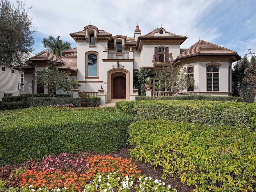 H.13416 - Wonderful & well-built in 2007! Open & bright, loaded w/upgrades! Absolutely ideal location in the heart of Olde Naples just 5 doors to the beach, 3 blocks to 5th Ave & 3rd St for the best shopping & dining! Luxurious ground floor master suite has a sitting area, two walk-in closets, separate vanities, soaking tub, king-sized shower! Also, there's a ground floor guest suite plus an elevator to 3 more spacious guest suites upstairs enjoy access to a covered balcony for glorious sunsets. Impeccably maintained, tasteful, casually elegant 5849 sq ft LA home w/5 BR+ Den, 4 full+ 2 half BA. Alley access to rear entry 3+ car garage Coffered volume and cathedral ceilings, granite, marble and onyx countertops, fireplaces, split bedrooms for privacy, chef’s kitchen, large impact picture windows with tropical landscape views, plantation shutters on most windows. Manicured grounds, brick paved circular drive. Open floor plan offers multiple areas for entertaining.  Tropical lagoon pool and spa beckon guests outdoors to enjoy the patio and summer kitchen amidst the lush environs.