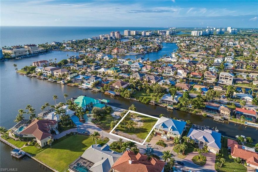 Opportunity awaits on this prime waterfront location with a brand New seawall installed July 2018. This Gulf access lot is just a few short minutes to the Gulf by boat and positioned on one of the most desirable streets in Conners Vanderbilt Estates. The public utilities renewal project underground work is complete bringing even more value to this coveted location. Watch the manatees and dolphins right in your own backyard and enjoy the second to none North Naples location that's close to Delnor Wiggins State Park, Vanderbilt Beach, La Playa, Ritz Carlton, Turtle Club & Mercato.