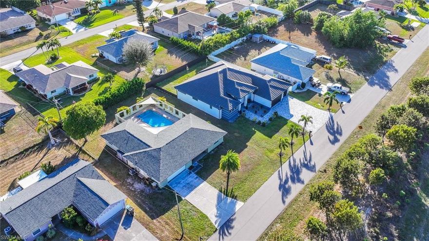 Spacious Courtyard Pool Home in Prime Cape Coral Location!
This 3-bedroom, 2-bath residence offers almost 1800 square feet of living space and a desirable courtyard-style layout centered around a large, oversized pool and expansive patio—ideal for entertaining or creating a private outdoor retreat.

Inside, the kitchen features granite countertops, a tile backsplash, and stainless steel appliances, opening to the main living areas. The family room includes a fireplace, adding warmth and character to the home. Additional highlights include an interior laundry room, nice window coverings, and a 2-car garage.

The property presents an excellent opportunity for buyers looking to add value, as it requires light rehabilitation, including replacement of carpeting and interior paint—allowing you to customize the space to your taste. The roof is less than two years old, and utility assessments are paid off offering added peace of mind and long-term value.

Located in Cape Coral, enjoy year-round sunshine and access to over 400 miles of scenic canals, ideal for boating and waterfront activities. The city offers convenient proximity to beaches, major airports, and top Florida destinations.

Known for its dining, abundant recreation, and well-established communities, Cape Coral supports both leisure and professional lifestyles. A solid opportunity to own a spacious home in one of Southwest Florida’s most sought-after cities.