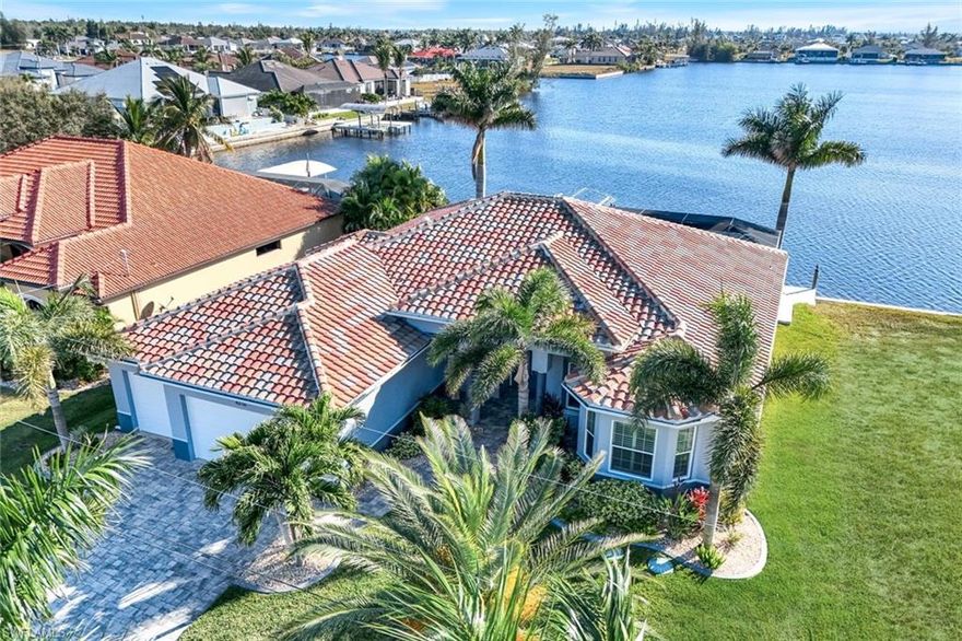BREATH-TAKING SOUTHERN EXPOSURE DIRECT GULF ACCESS w/ NO BRIDGES and endless PANORAMIC UNOBSTRUCTED LAKE VIEWS in NW CAPE CORAL:  Your Florida dream oasis is here!  Exclusive and luxurious upscale living that will truly take your breath away!  Upon entering the 2018 year built oasis w/ over 2700 sq, 4 bedrooms + Den and 3 car garage w/ GREAT ROOM w/ WIDE-OPEN floorplan, revealing Kitchen w/ GAS Range, Great Room w/ gas fireplace and Dining with 90 degree zero corner sliders, leading you to your favorite entertaining experience with family and friends on your gorgeous lanai w/ outdoor kitchen and upscale INFINITY-EDGE HEATED POOL/SPA with water features and panoramic screen enclosure, drawing you to direct gulf access Lake Lavedo which seems to never end!  THIS IS an experience of lifetime and it is yours!  DEFINING QUALITIES and KEY ATTRIBUTES:  90 degree zero corner sliders, Gas double oven range, custom design lighting and fan fixtures, custom tile designs in baths, upscale decor throughout, upgraded tile flooring, gas fireplace in the Great Room, plantation shutters, custom tile and backsplash design in baths, granite countertops, custom mirrors, outdoor kitchen and heated salt-water infinity-edge pool and spa w/ built-in fire pit feature.  Monitored security system, IMPACT resistant windows and doors and surround sound and so much more!  Water is professionally treated with a whole-house reverse osmosis system.  Dock your boat in your backyard on the 10,000 pound boat lift w/ composite dock.  Follow the NW spreader canal south past luxury gulf access properties and mangroves, West Cape Estates, Tropicana Park and the Seven Islands on your way to Matlacha Pass and the Gulf!  5 minutes from newly completed Crystal Lake Park w/ a new beach and boat launch location.  10 minutes to CORAL OAKS GOLF COURSE!   THE VIDEO AND DRONE TOUR IS AN ABSOLUTE MUST SEE !!  TRANSFERABLE FEMA POLICY FOR NEW BUYERS.  NO HOA's!