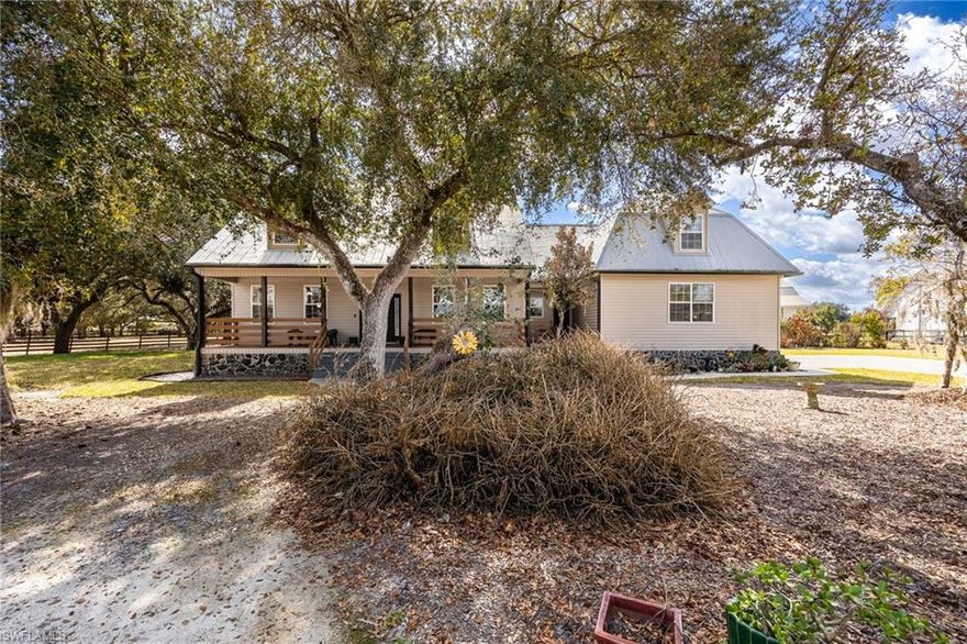 Experience true country living in beautiful Alva with this exceptional multi-generational property featuring a spacious main home and fully equipped guest house on a fully fenced parcel with room to roam.
This impressive 4-bedroom, 3.5-bath, two-story residence offers comfortable living and thoughtful design throughout. Inside, you’ll find volume ceilings that create a bright, open feel, a well-appointed kitchen with a convenient breakfast bar, and a generous primary suite featuring dual sinks in the master bath. Additional interior highlights include a laundry tub and functional spaces designed for everyday ease.
Perfect for extended family, guests, or potential rental income, the separate guest house includes 2 bedrooms, 1 full bath, a full kitchen, a comfortable living area, a charming screened front porch, and an expansive open back porch—ideal for enjoying peaceful Florida evenings.
Step outside and enjoy a fantastic patio and backyard entertainment area, perfect for gatherings large or small. The property is fully fenced and equipped for both comfort and self-sufficiency with a water treatment system, propane tank, and whole-house generator.
Need space for equipment, hobbies, or animals? Multiple pole barns and an additional outbuilding provide incredible flexibility and storage options.
If you’re looking for privacy, space, and versatility—all while being within reach of modern conveniences—this unique Alva property offers the perfect blend of comfort and country charm.