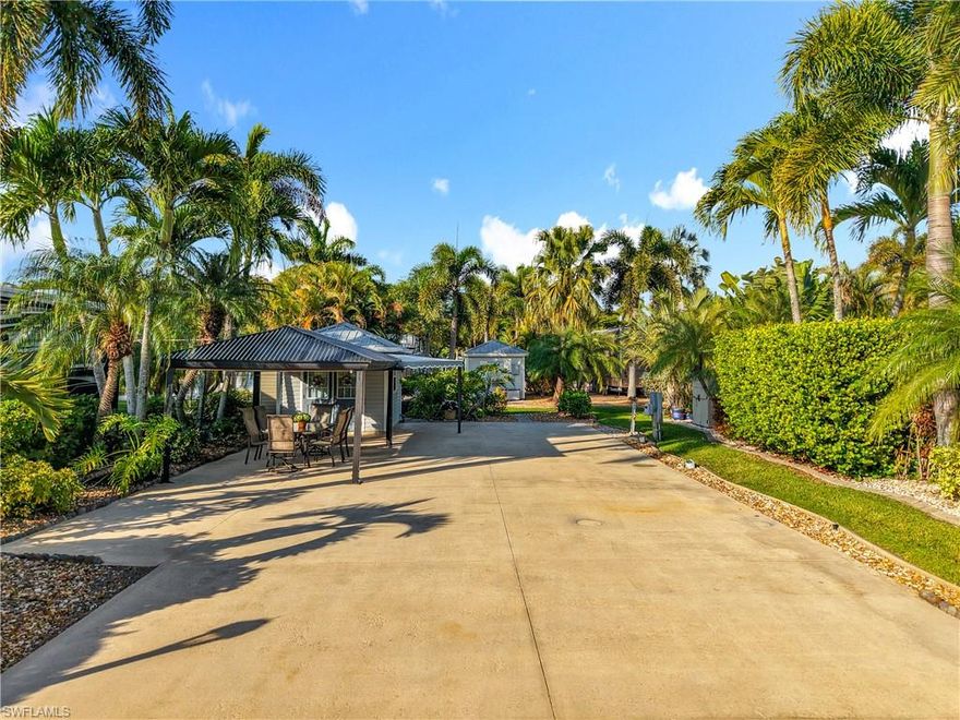 Lot D15 is a lushly landscaped RV lot that is perfect for larger motorhomes or fifth wheels, in a private culdesac with a large green space for privacy.  The property has a finished accessory building with shower, toilet, full size washer and dryer, refrigerator, and plenty of cabinet and counter space.  There is a large wrap around awning off of the accessory building and large gazebo.  Cypress Woods RV Resort is a luxury ownership resort. Amenities include 2 pools and hot tubs, shuffleboard, pickleball, tennis, and much more.  The Town center has a community room, card room, great room with large stage and large kitchen to host many of the community events.  The Welcome center has an additional card room, laundry, fitness center, and day spa.  Situated close to everything that South Florida has to offer.  Don't miss this one!!!