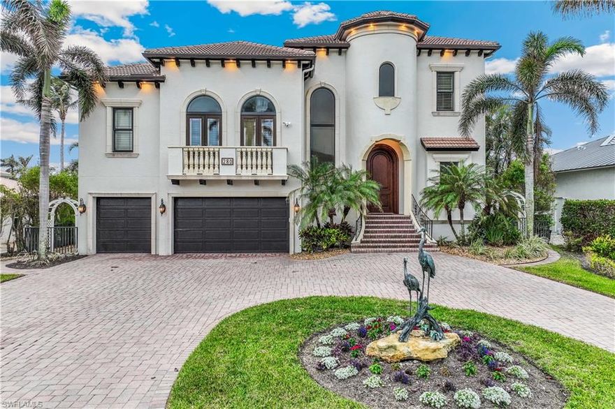 WOW, another price reduction- an incredible value you don't want to miss. This exceptional, high-quality home offers DIRECT GULF ACCESS and is just a short stroll from the BEACH. Included in the price is an impressive 30-FOOT BOAT and two JET SKIS, making this a dream opportunity for boating and sun enthusiasts. The property features a spacious dock, a powerful 28,000-lb boat lift, a secondary lift for a jet ski, a seawall, and a durable fiberglass deck board. This Southern-exposure residence has been meticulously designed with every detail in mind. Step through the stunning 10-foot arched mahogany front door and into a spacious, welcoming interior with an open floor plan ideal for both relaxing and entertaining. This quality, custom-designed home is being sold furnished with elegant pieces throughout. Showcasing exceptional craftsmanship and attention to detail, the residence offers 4 spacious bedrooms, a den with custom-built-in shelving ideal for a home office, and 4.5 bathrooms. The light-filled living and dining areas flow seamlessly into a welcoming family room, perfect for entertaining or relaxing. The formal dining and living areas are combined, featuring a fireplace with a wall of French doors leading to an outdoor covered terrace overlooking a wide canal. Notable features include extensive crown molding, high ceilings, hidden A/C vents, impact windows and doors, plantation shutters, and an elevator that provides access to all three levels. Energy efficiency meets modern living with 27 solar panels, Tesla power banks, spray foam attic insulation, and a 3-car garage. A specious family room offers large picture windows, a volume ceiling with wood beams, and is adjacent to a large kitchen. The gourmet kitchen is a chef's dream come true. It is equipped with a six-burner gas cooktop, warming drawer, Sub-Zero refrigerator, wine cooler, stainless steel appliances, a walk-in pantry, breakfast bar, and stunning granite countertops. The primary suite is a true retreat, accessed through double doors and offering a private seating area, two spacious walk-in California closets, and a private balcony for quiet moments outdoors. The luxurious en-suite bathroom features dual vanities, a Jacuzzi tub, a bidet, and a separate large walk-in shower. Each guest bedroom includes its private bathroom, with one bedroom conveniently located on the first floor, perfect for hosting guests. The outdoor space is just as impressive as the interior, featuring a spacious lanai, a fully equipped outdoor grill, ample lounging areas both covered and open, and a heated pool and spa to create a favorable entertaining space for family and friends or enjoying peaceful, private evenings. Conveniently located close to Marcatto Shopping Center, Whole Foods Market, Restaurants, Golfing, and many other attractions, this is more than a home-it's a lifestyle! Unbeatable Conners/Vanderbilt Beach Location!
