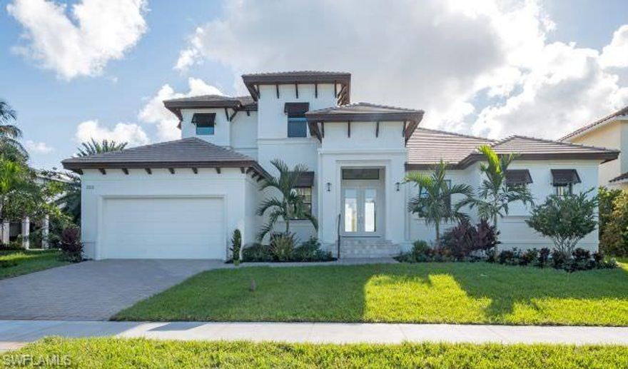 This two-story, great-room floor plan offers big water access and beautiful Southern facing water views. (Photo is not of the actual home being built and is for representation only.)  The large, covered lanai and outdoor kitchen area, create the ideal space for comfortable outdoor dining and entertaining. A central island is the focal point of the gourmet kitchen complete with stainless steel, Cafe appliances, dual pantries, custom cabinets and quartz countertops. Upstairs offers family and friends on-suite bedrooms, an open loft/media area and access to a second lanai with long water views. Other features will include tray and vaulted ceilings, high impact windows and doors, tiled roof, paver driveway, walk and lanai, tile flooring in the central living areas, a two-car garage with epoxy finish floor and so much more. Purchase includes a two-year builder's warranty.  Scheduled completion is Spring of 2023.
