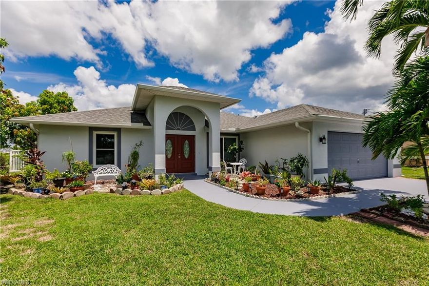 *** ON CITY WATER AND SEWER! * ASSESSMENTS FULLY PAID BY SELLER! * NOT IN A FLOOD ZONE! * WITH POOL ON A FRESHWATER CANAL! * 1,934 SQFT OF LIVING SPACE! *NEW ROOF! * IN A DESIRABLE NEIGHBORHOOD! *** Welcome to your dream waterfront living! This spacious 3 bedroom with den, 2 bathroom home located in Cape Coral, Florida offers a serene retreat on a freshwater canal with a seawall. Boasting 1,934 square feet of living space, this home is designed for comfort, relaxation, and entertainment.  New roof, impact doors and windows, new water boiler, new carpet in bedrooms, new kitchen backsplash, freshly painting interior walls and fleshly painted exterior walls of the house are a few of the benefits of this beautiful property.  As you enter the home you're greeted by the open floor plan and an abundance of natural light making this space wonderful for entertaining family and friends. The well appointed kitchen is equipped with modern appliances, and ample counter space. The master bedroom retreat features a large walk-in closet and a master bathroom with a ADA accessible shower.  Two additional bedrooms, two additional walk-in closets and a full bathroom ensure comfort for family members or guests. There is also an additional space that can be used as an office, exercise area or small room. Step outside to discover the true beauty of this home's location. Glass pocket sliders lead into the pool deck. It overlooks the tranquil freshwater canal, offering a perfect setting for enjoying the Florida lifestyle year round. The property features a seawall, providing easy access for boating, fishing, and water activities right from your backyard. This oversized lot comes with five mango trees, one avocado tree and one soursop tree.  Imagine sipping your morning coffee or watching the sunset as you soak in the peaceful ambiance of waterfront living. Located in Cape Coral, known for its waterfront lifestyle and outdoor recreational opportunities, this home offers convenient access to shopping, dining, entertainment, and top-rated schools. Explore nearby parks, nature preserves, and beaches, or take a short drive to downtown Cape Coral, Matlacha or Fort Myers for additional amenities. Don't miss this opportunity to own a piece of paradise. Schedule your showing today and experience the best of Florida living in this charming Cape Coral waterfront home.