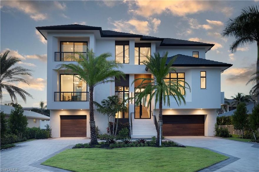 WALK TO THE BEACH AND HAVE A BOAT IN YOUR BACKYARD! This brand new just completed and furnished! Experience the pinnacle of luxury waterfront living at 141 Channel Drive, a stunning new construction estate in the highly sought-after Vanderbilt Beach neighborhood. Built by Diamond Custom Homes, designed by Stofft Cooney Architects, and finished with interiors by EDGE, this fully furnished residence is move-in ready and offers the very best of coastal elegance.

Spanning 9,676 total square feet with 5,497 square feet under air, the home features five bedrooms, five full and one half baths, 12-foot beamed ceilings, a dramatic stone stair tower, naturally stained wood flooring, custom cabinetry, a bespoke range hood, and ornate shelving—all curated to perfection.

The outdoor living spaces are equally impressive with a summer kitchen, spacious lounge and dining areas, resort-style pool and spa, and a private third-level balcony off the primary suite with breathtaking waterfront views.

Just steps from the sand, this is one of the few places where you can dock your boat in the backyard and walk to the beach within minutes. With direct Gulf access and proximity to world-class dining, shopping, and entertainment, this home offers an unparalleled Naples waterfront lifestyle.