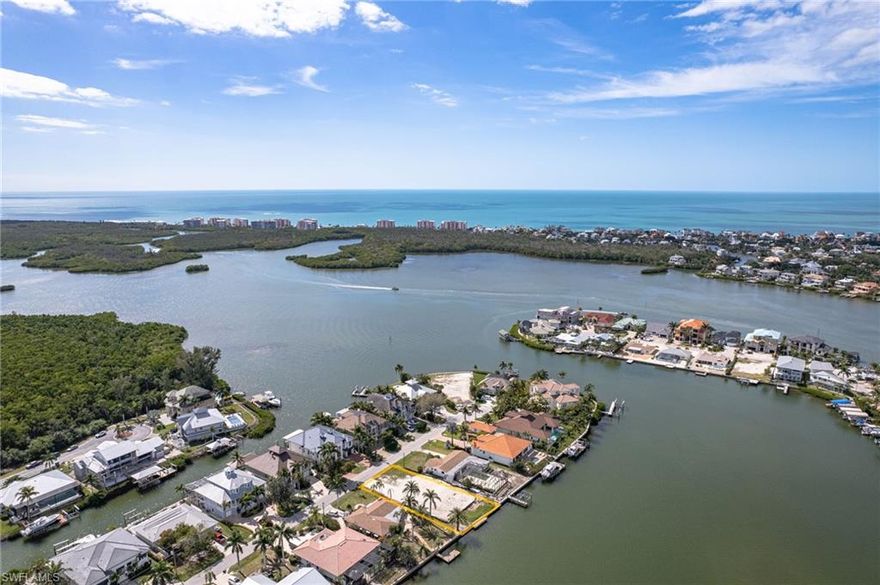 Discover the perfect opportunity to bring your waterfront dream home to life in North Naples, Collier County. This exceptional lot offers boaters and beach lovers alike the ideal location to create their ultimate retreat. With deep water access, a 75-foot sea wall, and no bridges to Wiggins Pass, this .25-acre gem is a boater's dream come true. Plus, enjoy the convenience of a brand new sea wall, ensuring peace of mind and added value. Note, the new sea wall has been raised up by one additional foot. Picture yourself enjoying stunning long water views and the tranquility of Little Hickory Bay with its northern exposure. Plus, the convenience of being just a short walk or bike ride from Barefoot Beach and Bonita Beach means endless days of sun, sand, and surf are within reach. Dock your yacht with ease and explore the Gulf of Mexico directly from your backyard, without any "no wake zones" slowing you down. This idyllic location, coveted for its proximity to SWFL International Airport, upscale dining, shopping at Mercato and Coconut Point, golfing, and entertainment, all without the burden of HOA fees, also boasts access to North Naples' prestigious school district, ensuring the perfect blend of convenience and quality education for families. With city water, sewer, and electric already in place, this lot is prime and waiting for you to break ground and begin constructing your dream home. Don't miss your chance to seize this prime opportunity and live the ultimate coastal lifestyle