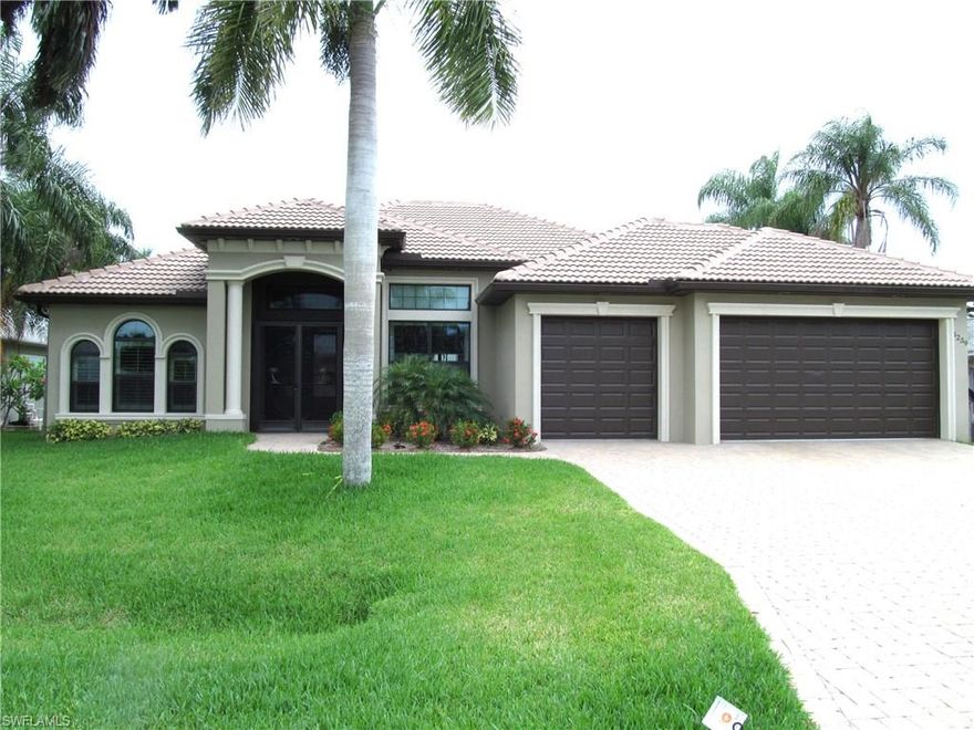 DIRECT GULF ACCESS WATERFRONT HOME just minutes to the Gulf of Mexico with no bridges, close to shopping, restaurants, parks and located in the popular yacht club area. This 3 bedroom, 3 bath home with den is almost new and has hardly been lived in built in 2015. Features, 3 car garage for extra storage ,  high impact windows and doors, plantation shutters, paver driveway,  tile roof, pool bath,  stainless steel appliances, tile throughout and hardwood floors in the master. The owners had this home custom built and spared no expense when choosing options and upgrades galore. Custom kitchen cabinets, granite counter top, eat in kitchen, breakfast room, and formal dining. The great room features high tray ceiling with crown molding and wide base trim. The 90 degree pocket sliding doors opens up the back of the home inviting you to enjoy the Florida lifestyle to the maximum either sitting in the covered lanai area next to the heated pool and spa or have refreshments at your outdoor summer kitchen. Follow the paver walk to the 10k lb boat lift and dock with captains walk that's complete with Tiki Hut. Put this home on your list as a must see.