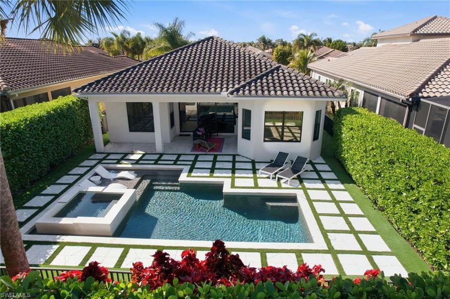 Located in a highly sought-after planned unit development, this upgraded 3-bedroom + den, 3-bath home offers privacy, functionality, and resort-style living. Features include diagonal hardwood flooring throughout, upgraded tile in baths, and a modern open great room floor plan with split bedrooms for added privacy. The kitchen is equipped with a gas range (rare for Naples) and opens seamlessly to the living space. The owner’s suite is privately situated and includes a mini-split system for enhanced comfort.

Enjoy a fully fenced backyard with low-maintenance turf, saltwater pool and spa, and electric heater for year-round use. Additional highlights include a 3-car garage and prime location just 20 minutes from RSW Airport, beaches, dining, and entertainment.

Community amenities include tennis, pickleball, fitness center, indoor/outdoor basketball, splash pad, two resort-style pools, a community room more.