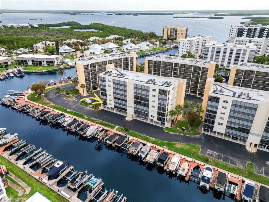 Coastal Elegance Meets Boater’s Paradise! Experience the pinnacle of island living in this 3-bedroom, 2-bath retreat at Hibiscus Pointe in the Bay Beach Community. Perfectly positioned on the first living level, this 1,200 sq. ft. END-UNIT blends "barefoot luxury" with effortless Florida functionality. Bathed in natural light, the interior features a crisp white kitchen and an open-concept living area that flows seamlessly onto a private screened lanai. Enjoy your morning coffee with western exposure and refreshing Gulf breezes. Property Highlights include Prime Location: First-floor convenience with under-building carport parking just steps away. Boater’s Dream: Private slips available for purchase with immediate access to Estero Bay and the Gulf.
Active Amenities include Access to the EBIA’s world-class offerings: tennis, pickleball, private beach paths, fishing piers, putting greens and a dog walk because Hibiscus Pointe is Pet-Friendly.  A welcoming community for full-time residents and seasonal escapes alike.
Whether you're kayaking through the mangroves of Lovers Key or cruising to Sanibel and Captiva for sunset dining, this residence offers the ultimate Fort Myers Beach lifestyle—both by land and by sea, Boat docks available for purchase.