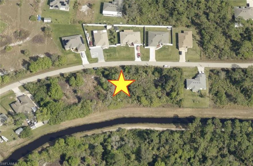 Great price for this OVERSIZED private residential lot on a small canal in the Greenbriar neighborhood of Lehigh Acres located just off Joel Blvd! Dimensions are 100' across the front, 80' across the rear of the lot and 151' on the sides. Build your dream home or buy and hold investment with low taxes. Not in a flood zone (X), no HOA and no CDD! Conveniently located to I-75, RSW International and Punta Gorda Airport, Red Sox and Twins training facilities, Florida Gulf Coast University, shopping, dining, entertainment and the amazing SW Florida beaches.